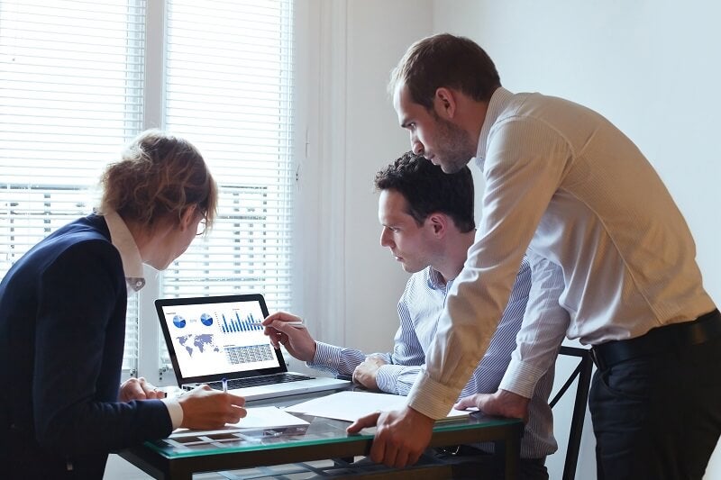 Business Meeting Reviewing a Dashboard