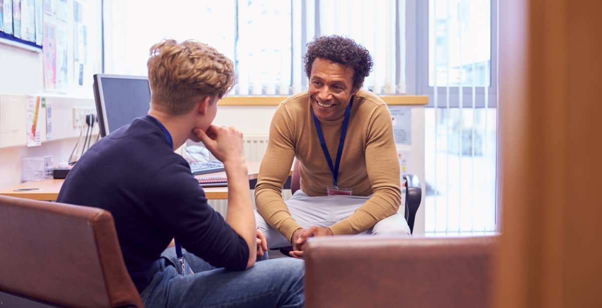 Clinical mental health counselor with young male client