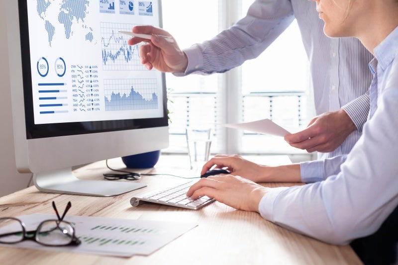 Business analyst using predictive analytics software