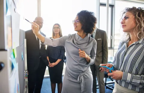 Female Boss Leading a Meeting